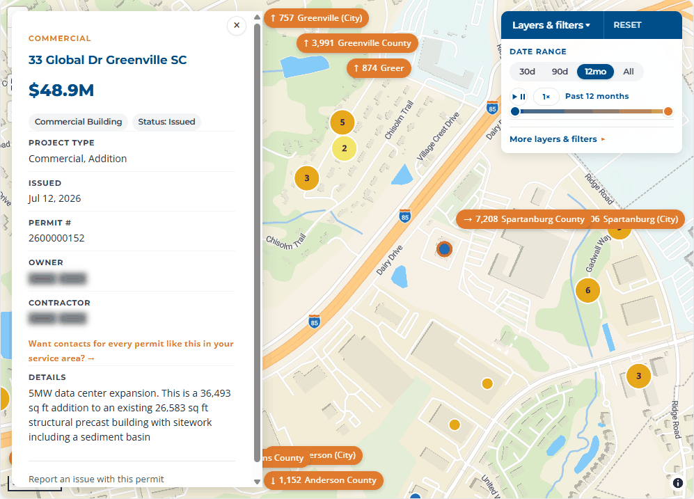 The Greenville Development Explorer map zoomed to a single highlighted permit pin, with its record open alongside: a $48.9M data center addition on Global Drive, owner and contractor fields masked.